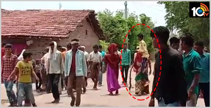 Woman forced to carry husband on shoulders and paraded as 'punishment' for eloping