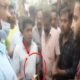 YCP activists distributing money to voters in ration distribution vehicles